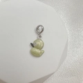 Detail of light green enamel duck charm with silver loop and sparkling crystal eye - Style F (Duck)