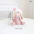 Detailed size and weight labels for a plush pink Christmas girl doll decoration - Pink Sitting Girl