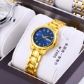 Macro shot of ORUSS gold quartz watch with blue sunray dial and day-date display - All Gold Band Blue Dial