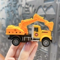 Detailed miniature yellow excavator toy keychain held by hand for scale display - Construction Vehicle Keychain-Excavator / Yellow
