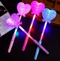 Pink, purple and blue heart-shaped LED fairy wands with star patterns for party fun - Glow Heart Wand