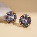 Macro shot of vintage geometric square earrings with purple stones and amber crystals - Silver
