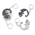 Detail of wooden interlocking cat keychains forming a balanced yin yang circle - Wooden Yin Yang Cats 1 Pair
