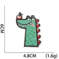 Close-up of green cartoon crocodile patch with red apple embroidery and 6cm size mark - No. 3 (Crocodile with Apple)