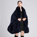 Navy blue knitted poncho featuring a soft faux fur collar and decorative fringed trim - Navy Blue