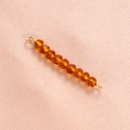 Close-up of faceted amber crystal beads with gold metal loops for jewelry making - 10# Khaki