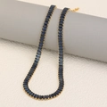 Elegant 18K gold plated tennis necklace with rectangular blue crystals on a pedestal - Gold-Blue Necklace