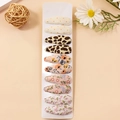 Set of 10 assorted fabric hair clips with floral, polka dot, and leopard patterns - Combination 14