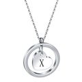 Macro detail of silver round frame and solid heart pendant with engraved letter X - Letter X