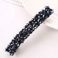 Close-up of deep blue multifaceted crystal hair clip on a minimalist ceramic tray - Navy Blue