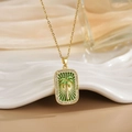 Macro shot of 18K gold plated tarot necklace with green palm tree and white zircon - Gold Palm Tree Green Enamel Style (XL0514)