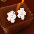Detail of silver flower stud earrings with hammered texture and pearl on brown velvet box - Silver (Silver Pin)