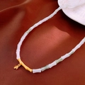 Detail of bamboo shaped beaded necklace with gold leaves on red silk fabric - 35# Necklace - Gold White Green Bamboo