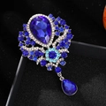 Exquisite silver-tone brooch featuring water drop blue crystals and a pendant - Light Blue