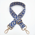 Detail of embroidered geometric diamond pattern on bag strap with gold metal lobster hooks - Royal Blue