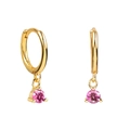 Detail of gold hoop earrings featuring round pink cubic zirconia in three-prong settings - Pink