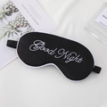 Black faux silk sleep mask with white Good Night embroidery and adjustable elastic strap - Black with White Edge