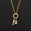 Gold plated stainless steel necklace featuring a cross and rectangular CZ stone charms - Letter T
