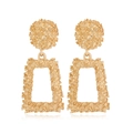 Detail of gold geometric earrings featuring hammered texture and a rectangular frame design - Style 7 (Clip-on)