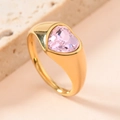 Polished gold heart ring with a faceted pink gemstone center on a stone prop - US 8 / Light Pink