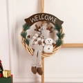 Christmas rattan wreath with plush reindeer and snowman toys with a Welcome sign - Christmas Reindeer