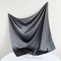 Detail of a 90cm black satin silk square scarf with soft texture and glossy finish - 90*90cm / Dark Gray