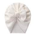 White ribbed knit baby turban hat with a large bow detail for newborns and infants - White