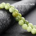 Natural Southern Jade round beads in pale green with smooth oily texture finish - Southern Jade