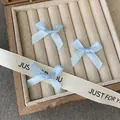 Three light blue ribbon bow hair clips in a sweet ballet style for DIY hairstyling - Blue