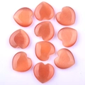 Orange heart-shaped cat-eye stone with smooth polished surface and unique chatoyancy effect - Orange Red Cat Eye