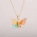 Close-up of butterfly pendant with colorful wings, gold foil, and white zircons - Gold Chain-Colorful Gradient
