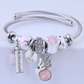 Adjustable stainless steel DIY bangle with pink angel charm and cat eye stone beads - Pink