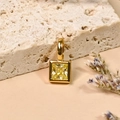 18K gold plated square necklace pendant featuring a yellow birthstone on stone surface - August/Yellow