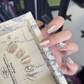Detail view of champagne gold cat eye press-on nails with luxury rhinestone accents - By1623 Golden Jade Pearl / Glue Type