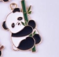 Cute black and white panda charm holding a green bamboo stalk with golden metal trim - Panda Climbing Bamboo