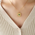 Gold plated square pendant necklace with green heart inlay on a female model - 40+5cm / Gold Green Glass Stone Necklace