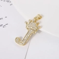 Macro shot of gold-plated J letter pendant with crown detail and micro-paved zircons - Letter J