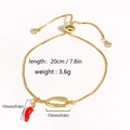 Gold chain bracelet featuring a red chili pepper pendant and zircon shell centerpiece - Gold