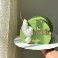 Detail of green semi-circle cake with white petals and gold Happy Birthday topper - Design No.8 / Gold