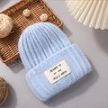 Light blue rabbit fur knit beanie with SEASCN 12 patch in a winter scene setup - Light Blue