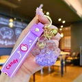 Cute purple cat paw liquid quicksand keychain with golden bell and silicone wrist strap - Purple Luminous Bubble Bead Cat Paw