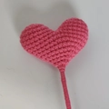 Handmade crochet pink heart bouquet with woven stem on a clean white background - Carmine