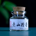 Laoshan Sandalwood powder in a glass vial with cork stopper for aromatherapy - Sandalwood Scent (Dry Pills)