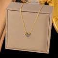 Elegant gold titanium heart necklace featuring a black inlay with beaded edging detail - AH183 Black Shell Beaded Heart Gold