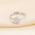 Detailed view of silver flower open ring with sparkling crystals on beige silk fabric - US 6 / Steel Color With Zirconia (5-Petal Flower) (KR103984-GC)