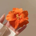 Vibrant orange hibiscus hair clip with realistic silk petals for women beach accessory - Orange Hibiscus Hair Clip