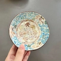 Detail of a handmade coconut bowl with blue and beige shell mosaic floral patterns - Blue Block Floral