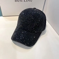 Detail of a sparkling black baseball cap featuring dense rhinestone and sequin embellishments - Adjustable / Black