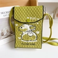 Macro view of green knitted crossbody bag with heart and cartoon puppy pattern details - Corgi Yellow