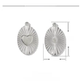 Detailed macro view of 20mm stainless steel oval pendant with heart relief and radial texture - Sunburst Oval Heart Style (VG351)